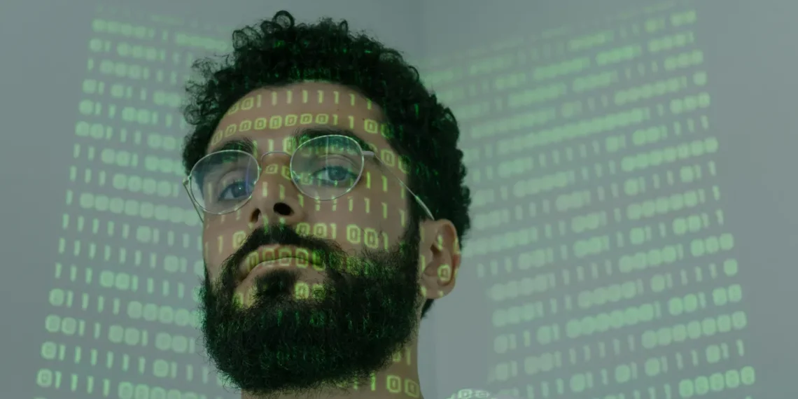 Matrixorganisation mand sidder med 1 taller og nuller i ansigtet