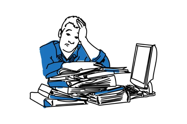 Ensomhed - tegnet mand i blå sidder ensom ved skrivebord